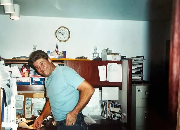 Bill Moppert Jr. at his office desk, 2002